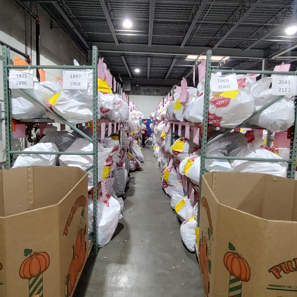 Aisle of Angel Tree bags in stored in warehouse
